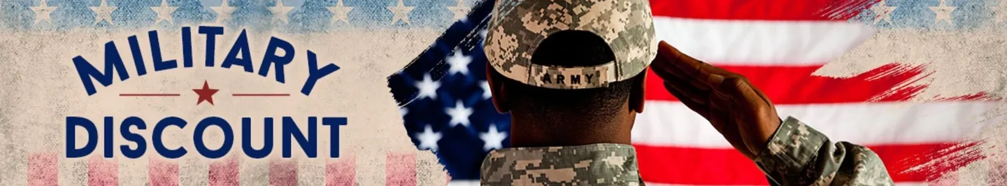 A soldier in fatigues and hat looking at an american flag.